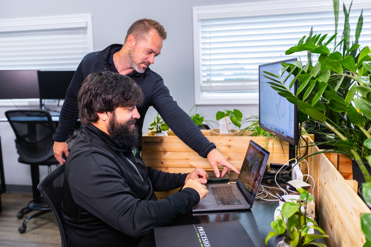 design team reviewing landscape designs