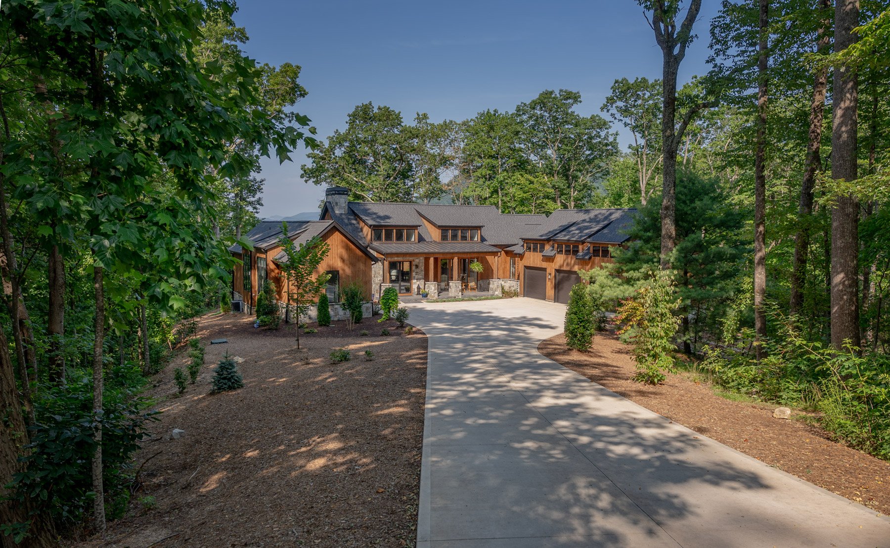 nice driveway entrance home mulch planting beds trees after