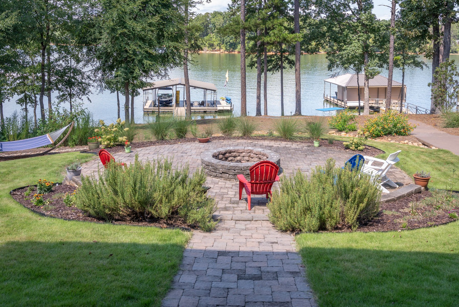 seating arranged around a stone paver fire pit