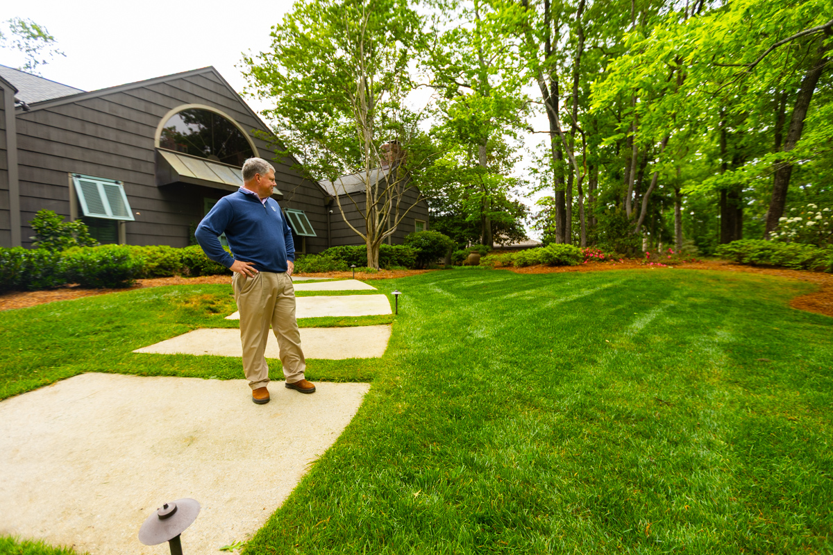 client looking at landscape lawn 5