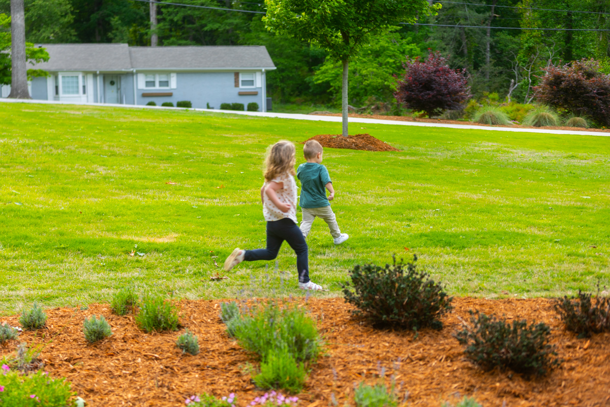 kids family playing yard grass client
