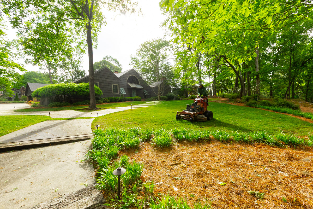 maintenance crew mowing lawn grass 3