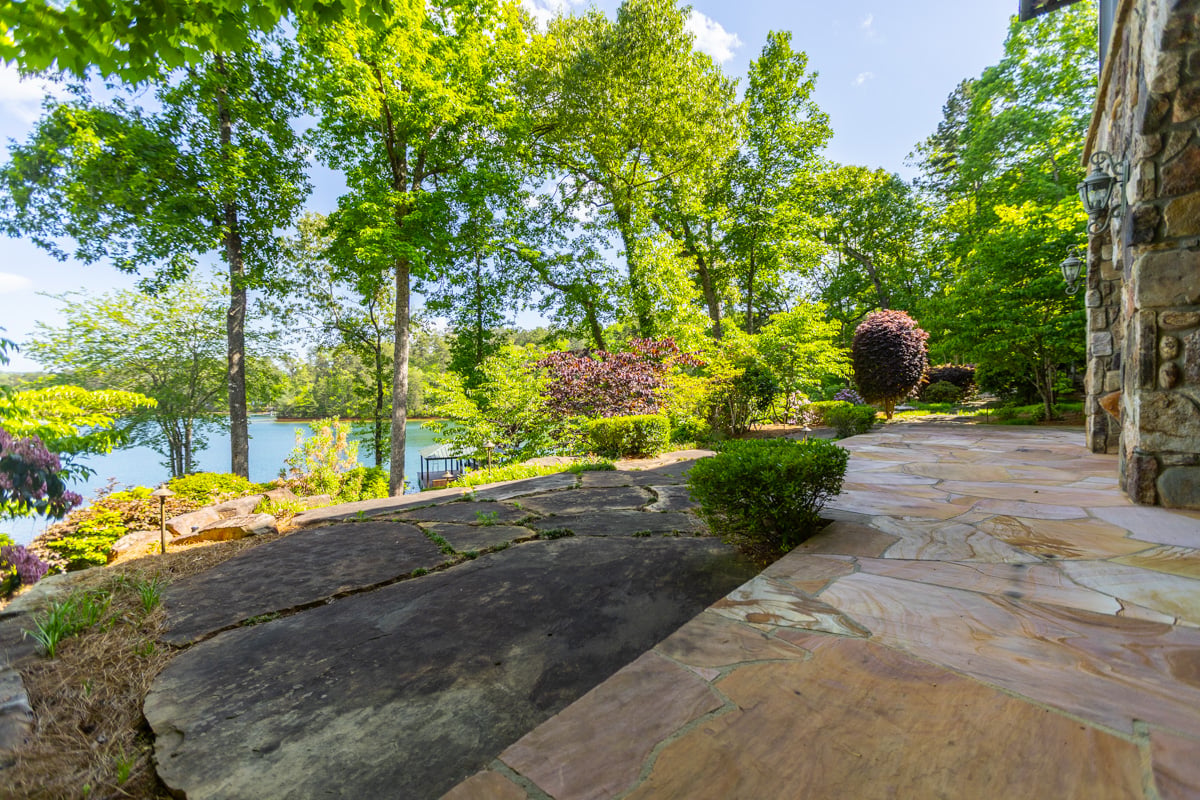 nice tree shrub smoke bush large stone steppers wall plants lake water
