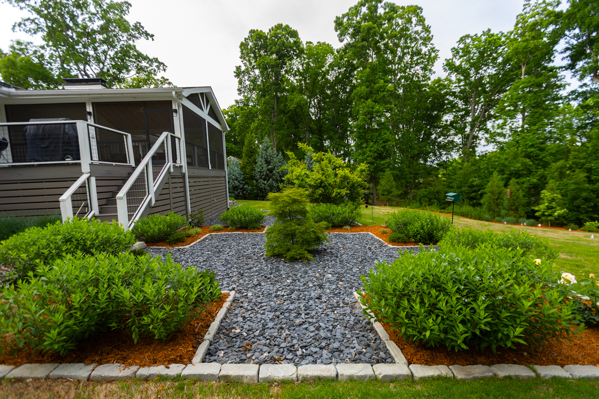 shrubs planting beds chip gravel deck stairs