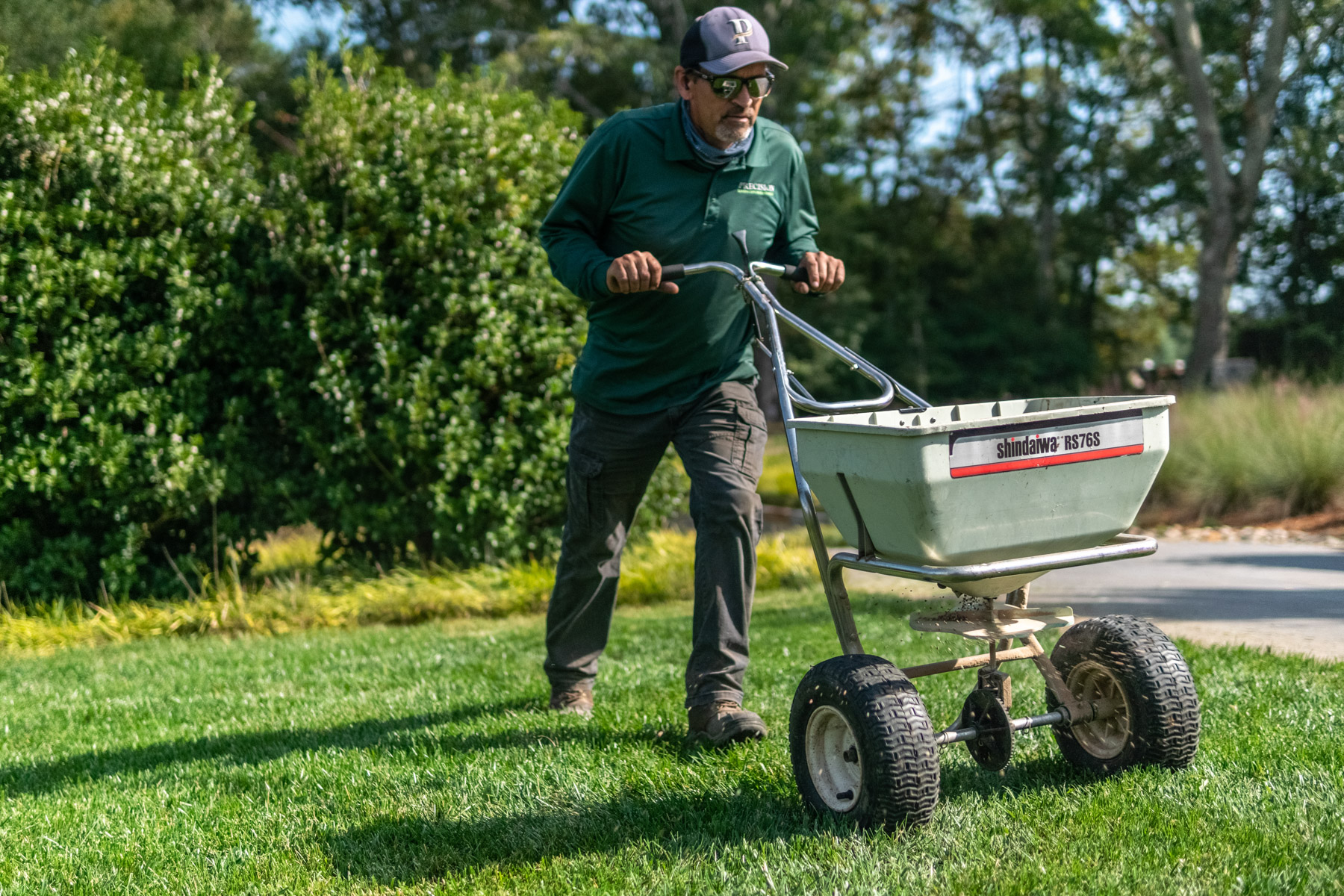 crew lawn care fertilizer application granular grass seed