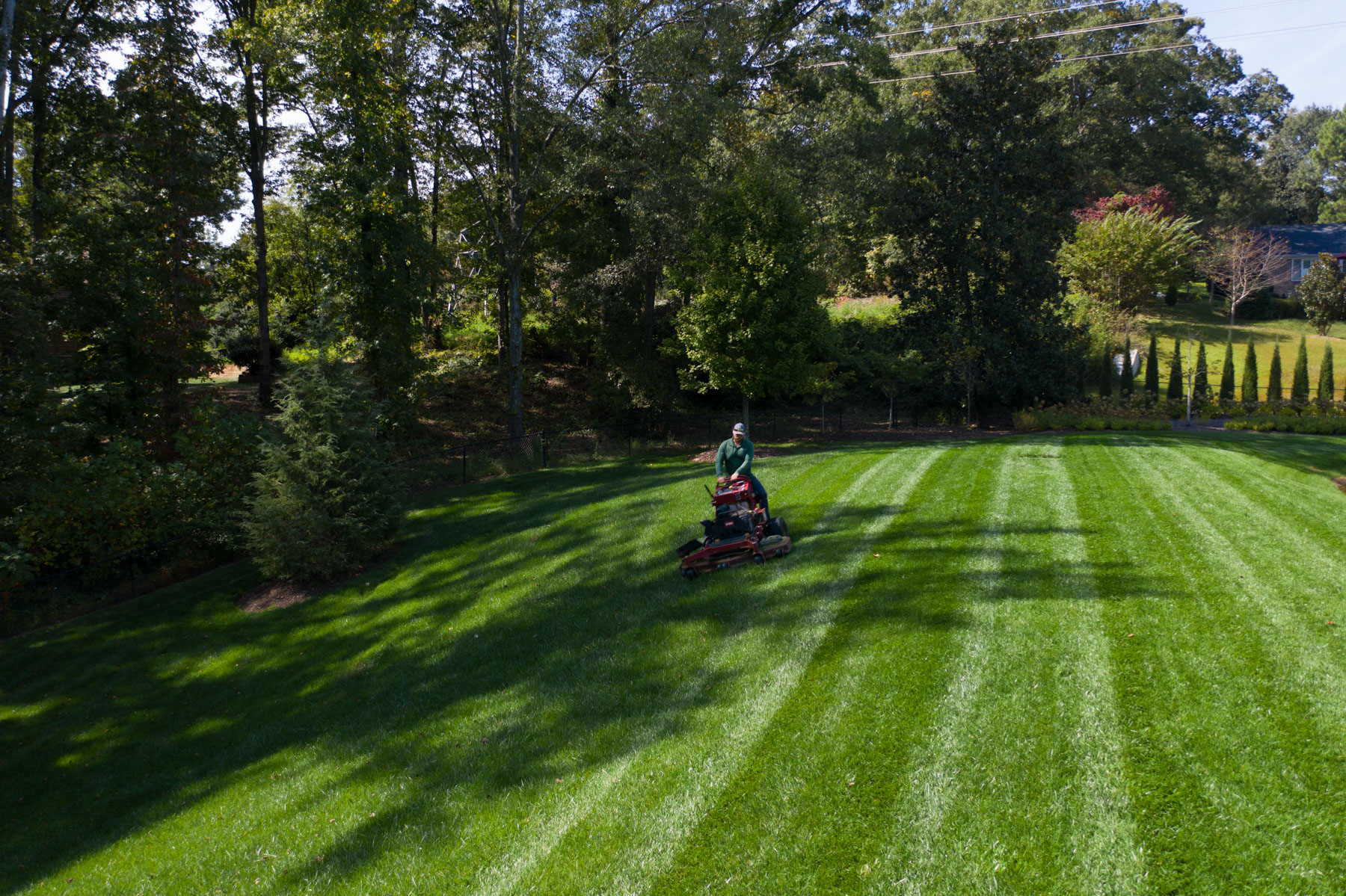 crew maintenance lawn mowing ride on lines grass