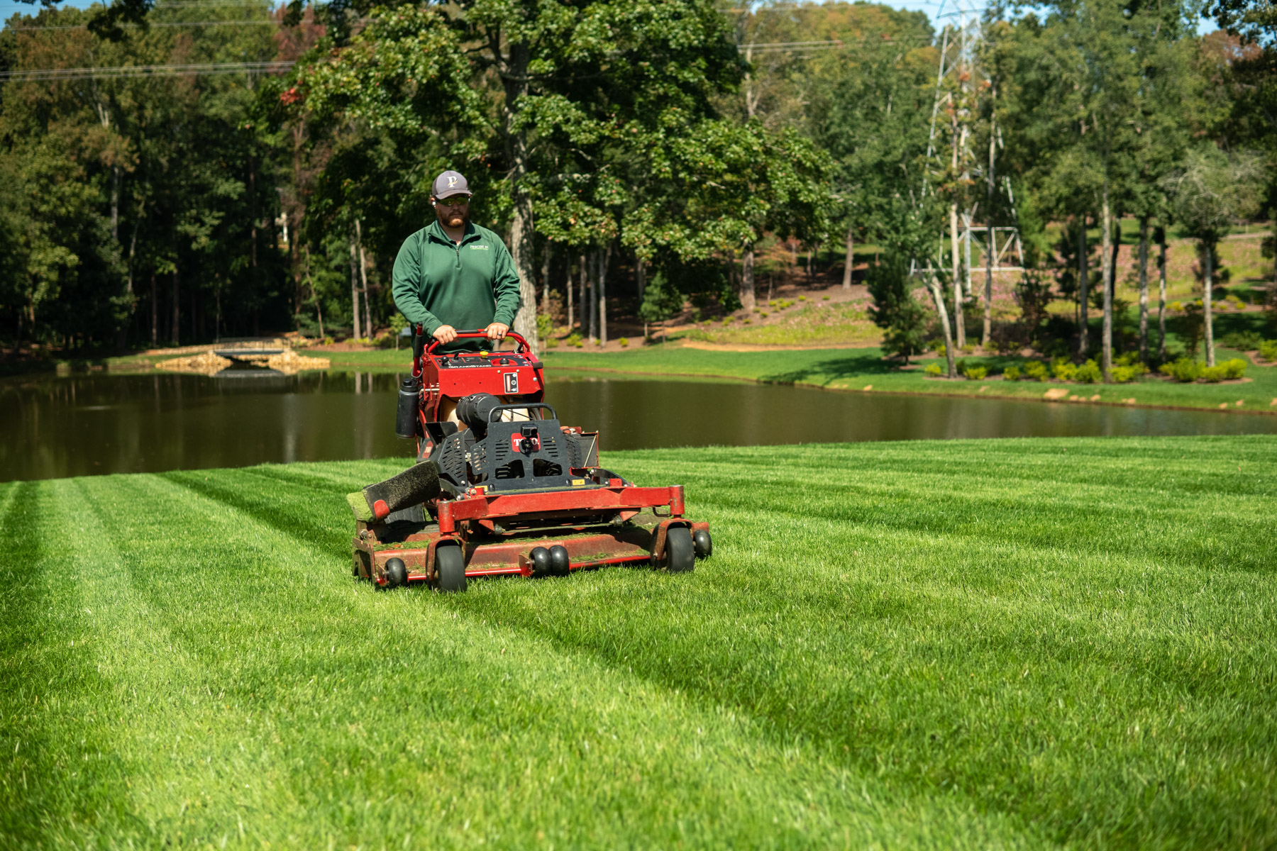 crew maintenance mowing grass lawn