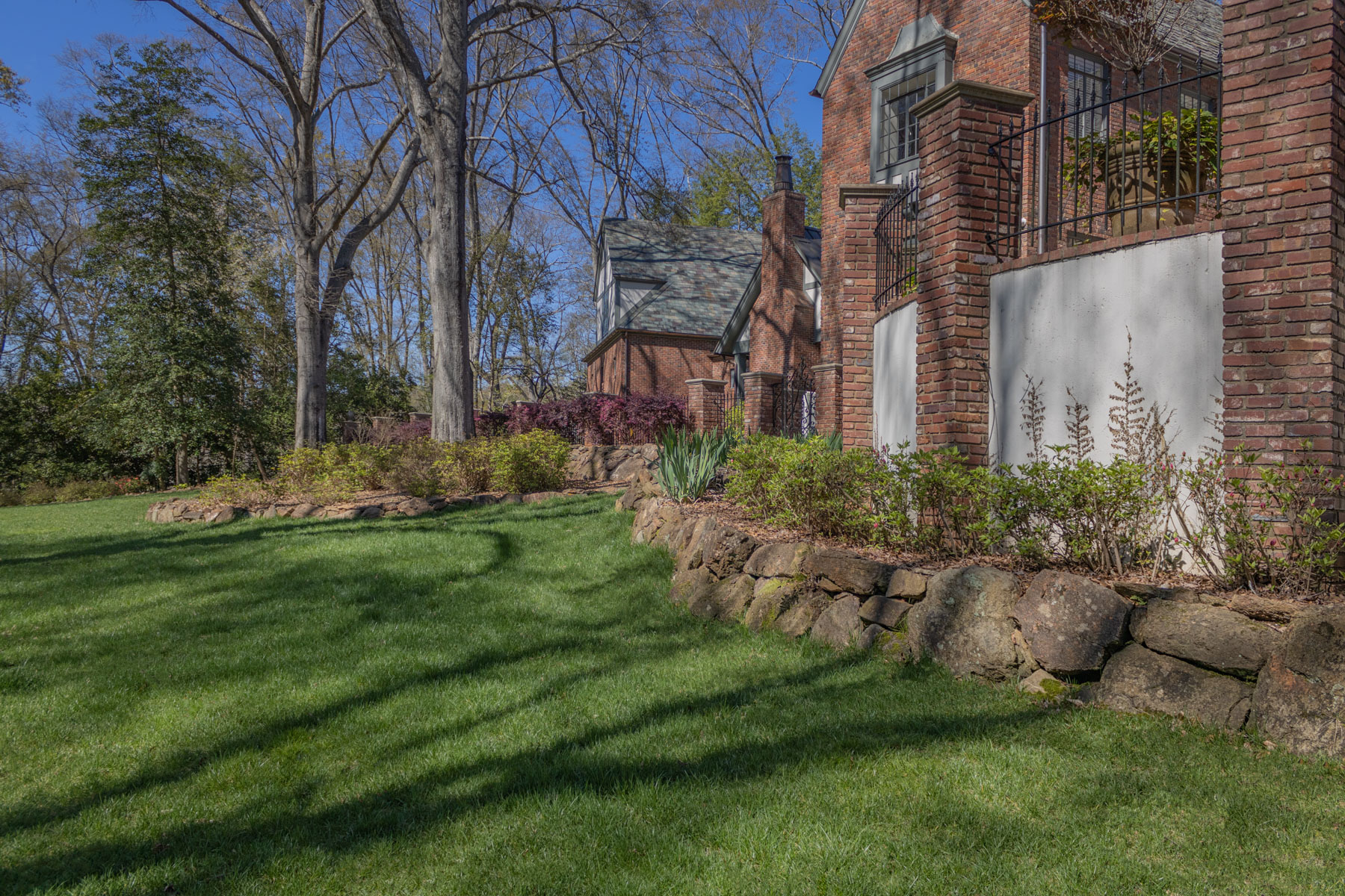 dry stack stone wall home plants grass