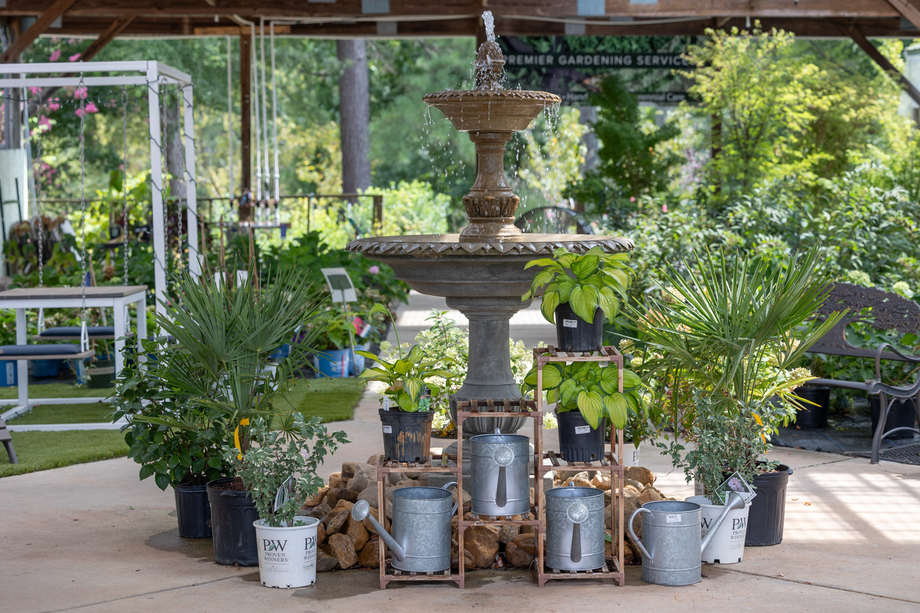 garden center display watering cans fountain water feature