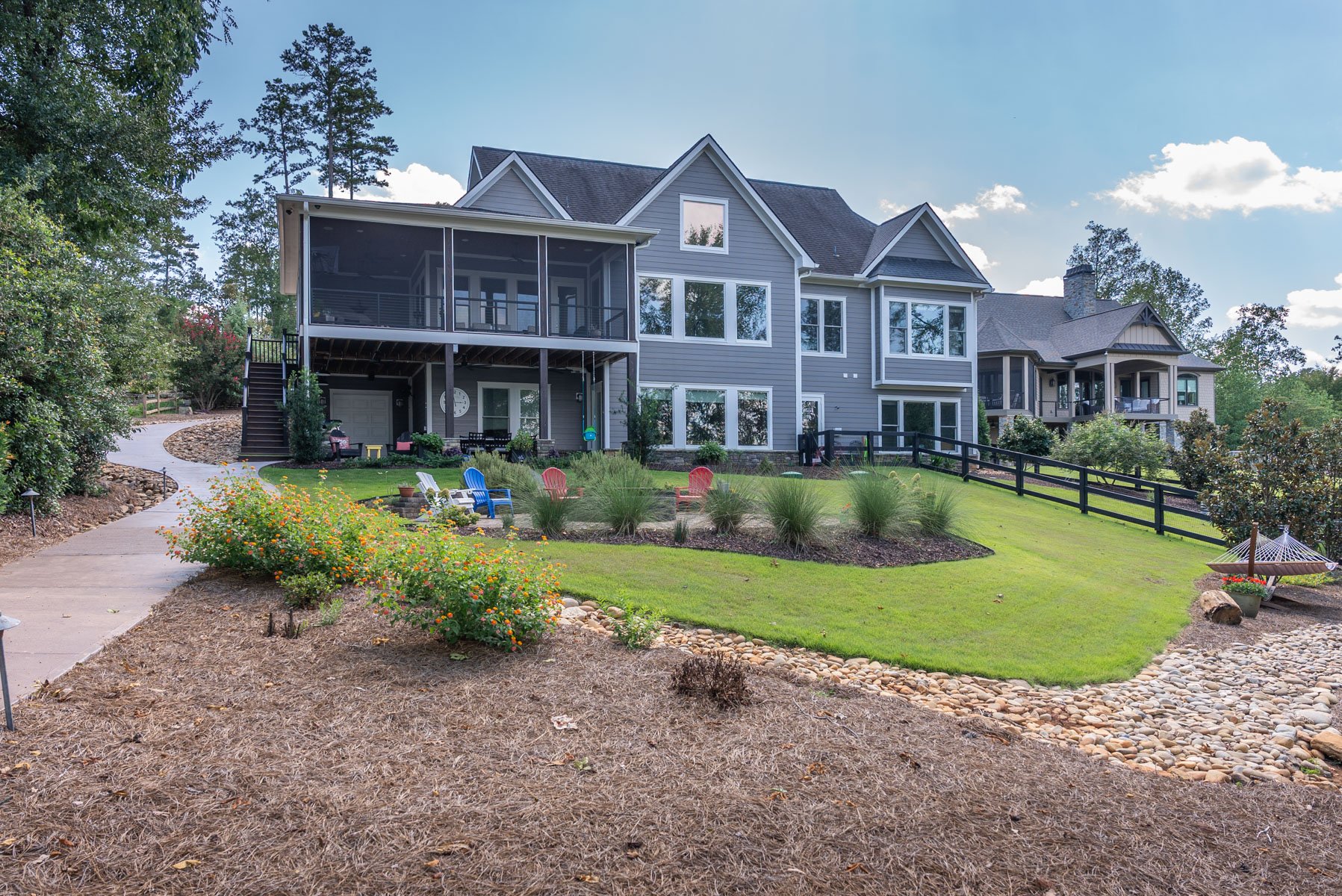 nice backyard grass mulch gravel bed swale firepit seating patio path