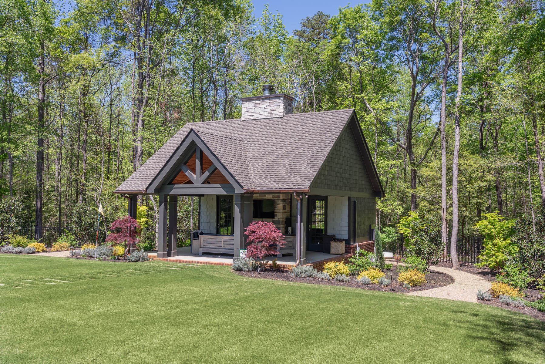nice gazebo structure patio seating fireplace grass planting bed path