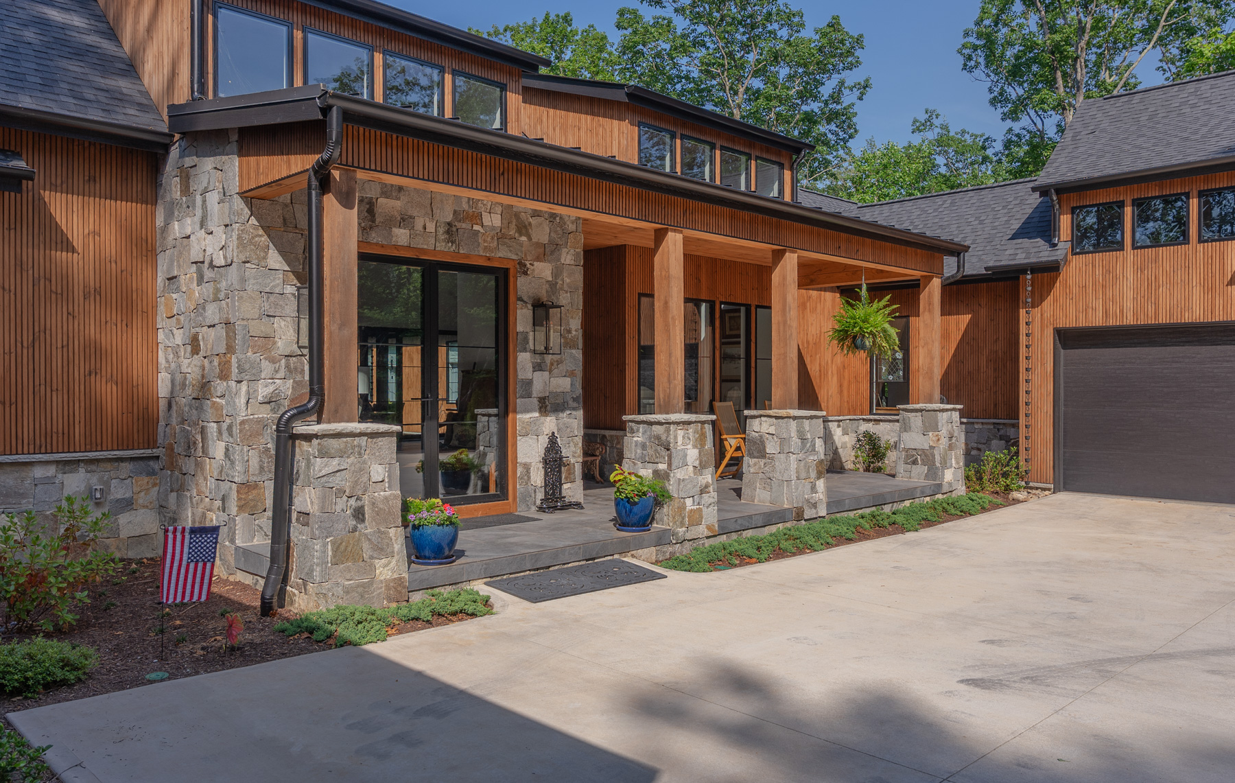 nice home entry planting bed groundcover driveway garage after