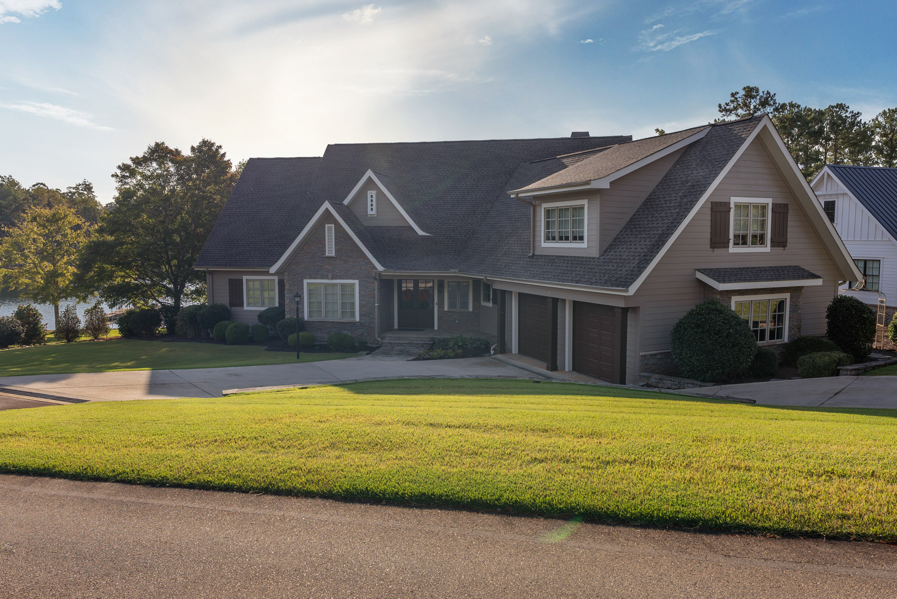 nice home grass driveway trees landscape